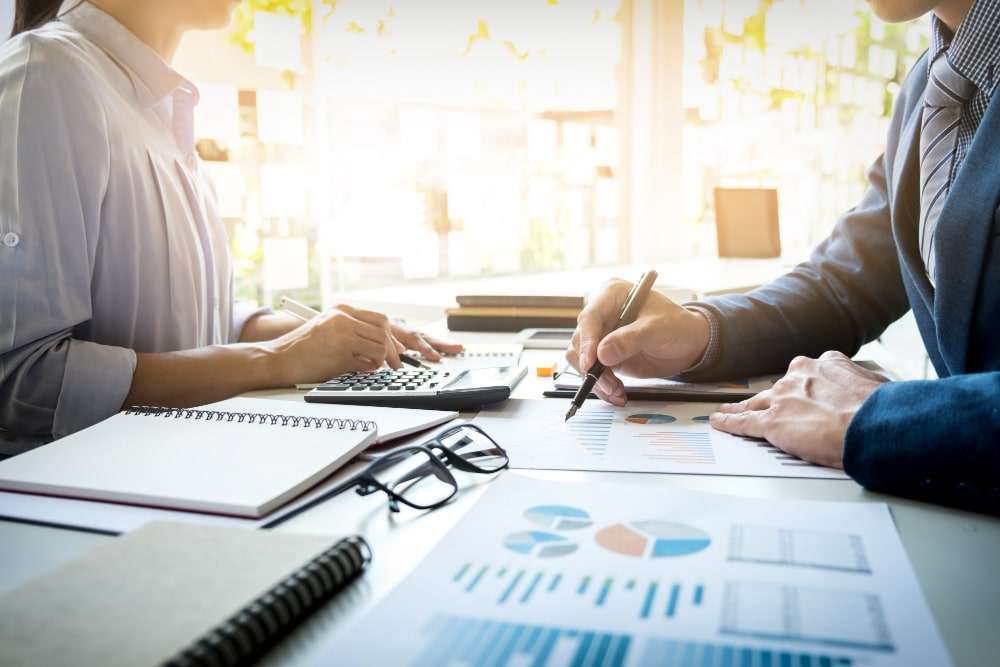 business-man-financial-inspector-secretary-making-report-calculating-checking-balance-internal-revenue-service-inspector-checking-document-audit-concept-min